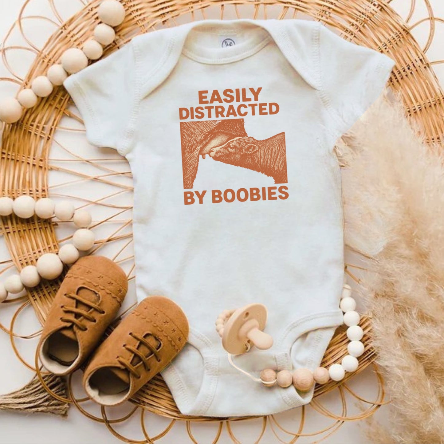 Easily Distracted by Boobies Baby Onesie product